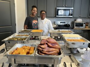 Mac and cheese, fried chicken, collard greens, and cornbread served by LoS Private Catering.